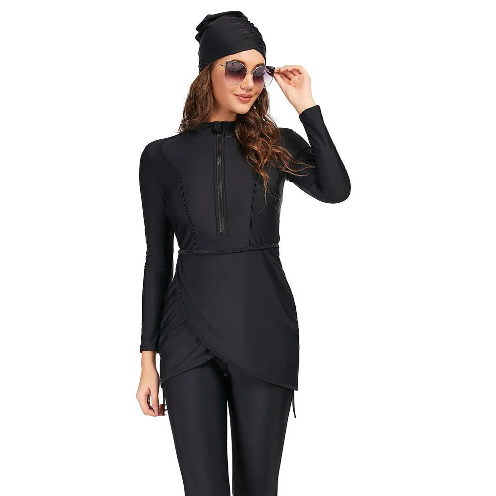 Black conservative Muslim ladies' two-piece swimsuit set on a mannequin, showing full-coverage top and pants design.