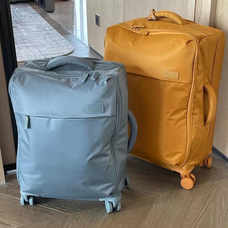 Ultra-light waterproof Oxford cloth suitcase in bluestone green colour with universal wheels
