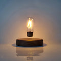 Magnetic levitation bulb night light in solid wood colour with UK plug on a desk.