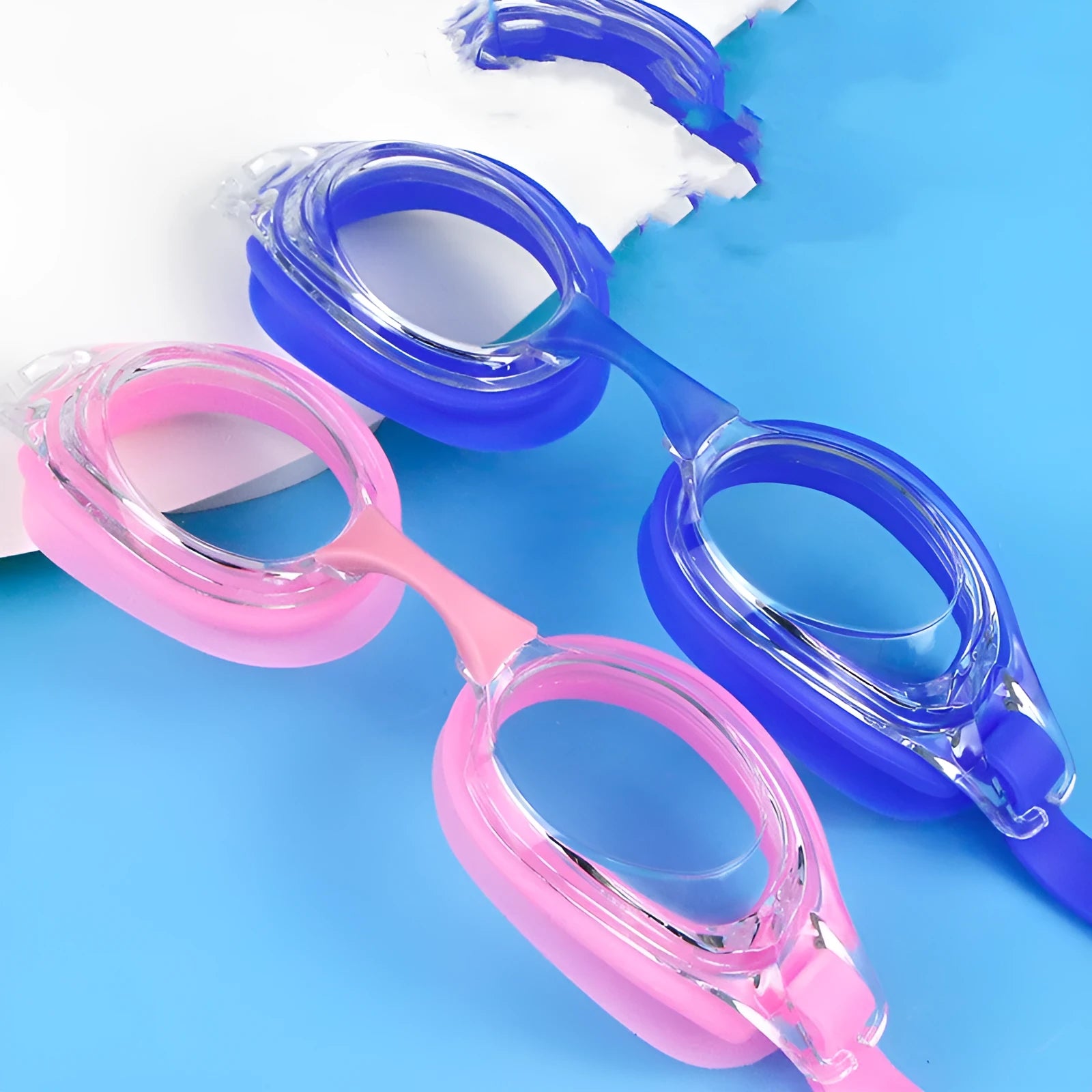 Black swimming goggles with corrective lenses next to a protective case.