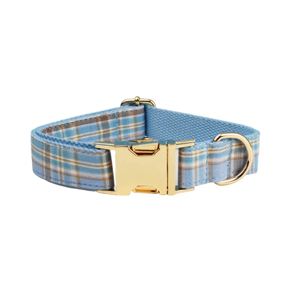 Sky blue grid forest pattern dog collar and leash set with matching vest and decorative bow.