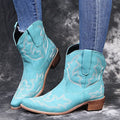 Women's blue embroidered cowboy boots with wedge heel and pointed toe