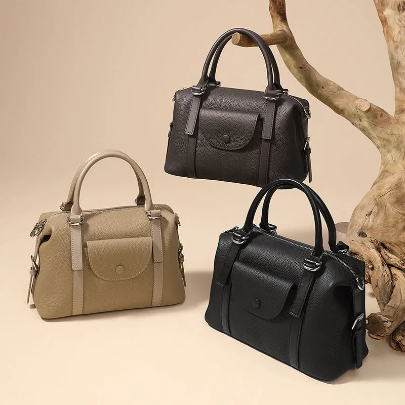 Genuine leather ladies' handbag in three colours with shoulder strap and lock fastener