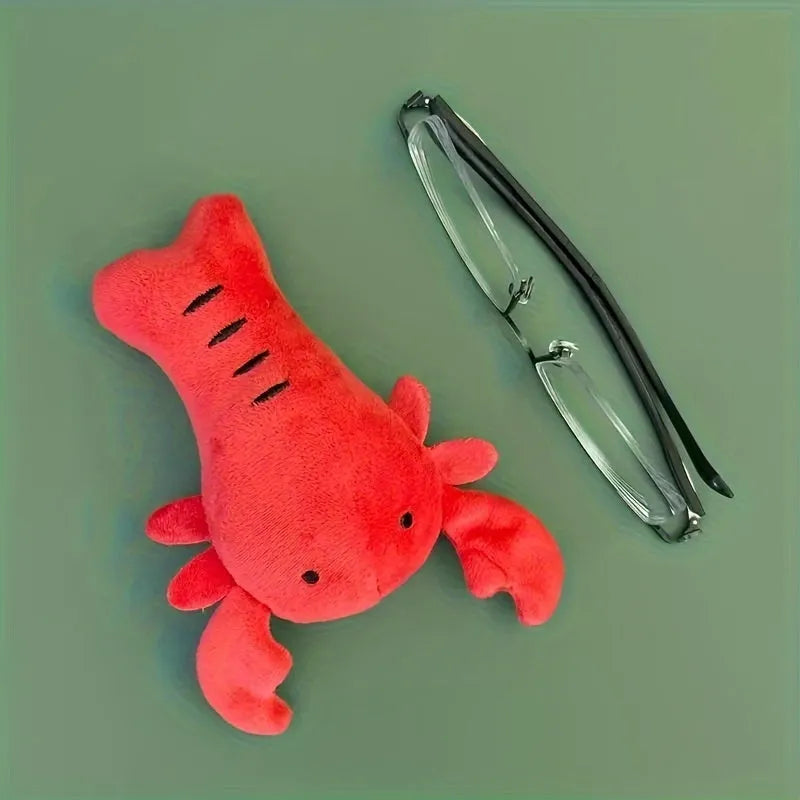 Red lobster-shaped squeaky dog toy with crab-lobster design measuring 12.5cm long