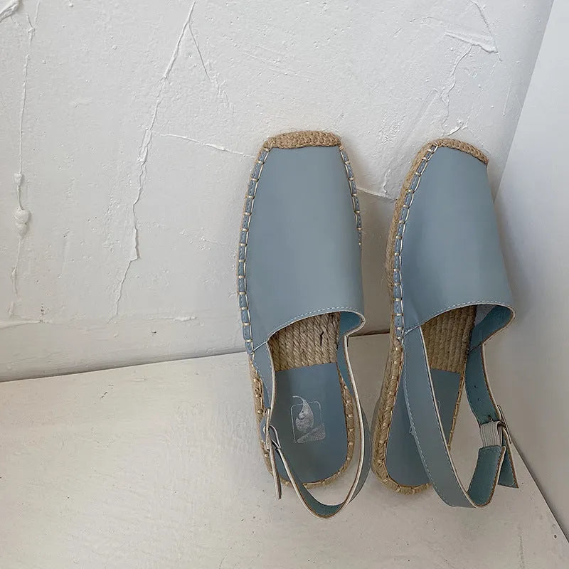 Women's flat sandals in retro fisherman style with canvas upper, soft leather, and animal pattern in yellow colour.