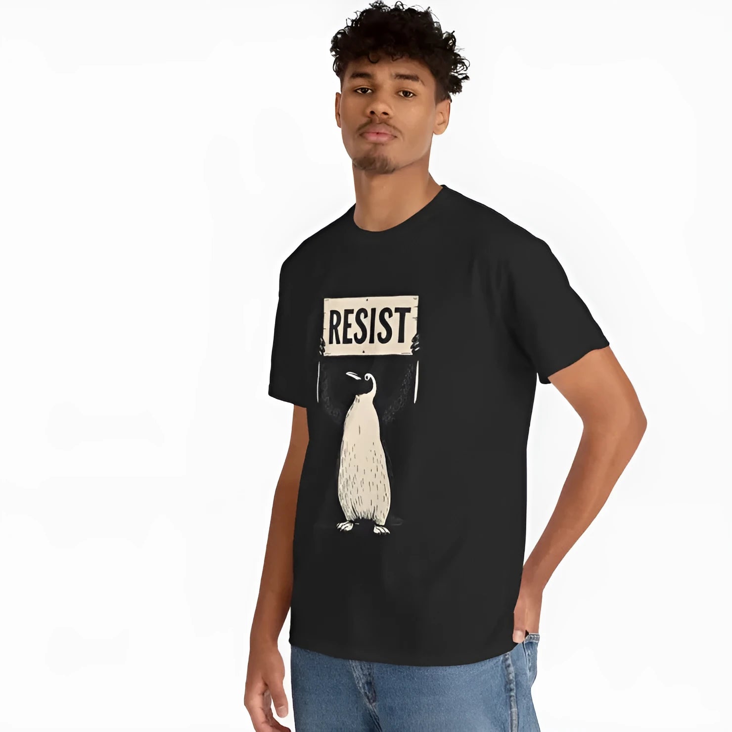A loose-fitting black cotton T-shirt with short sleeves and a round neck on a hanger.