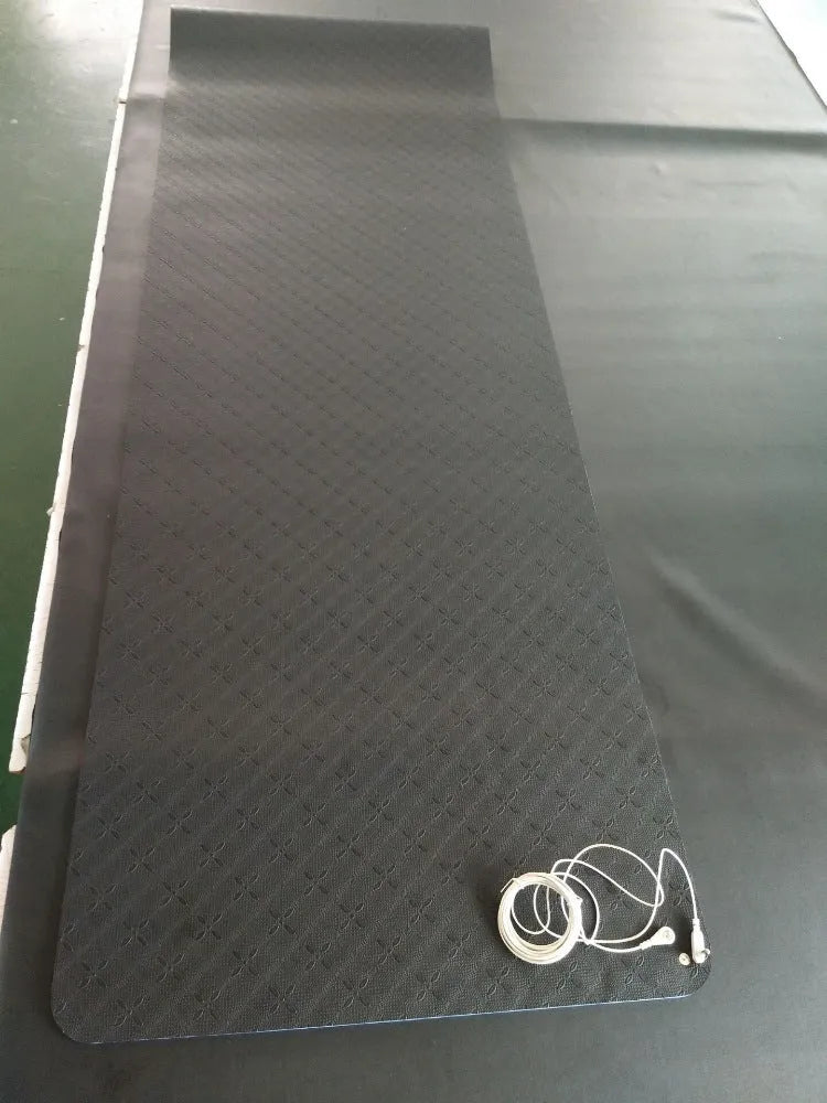 Blue conductive grounding yoga mat with floral pattern, showing grounding wire and 182cm x 61cm x 5mm dimensions.