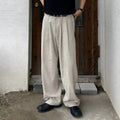 Army green men's casual drawstring waist trousers laid flat, showing the basic style and relaxed fit.