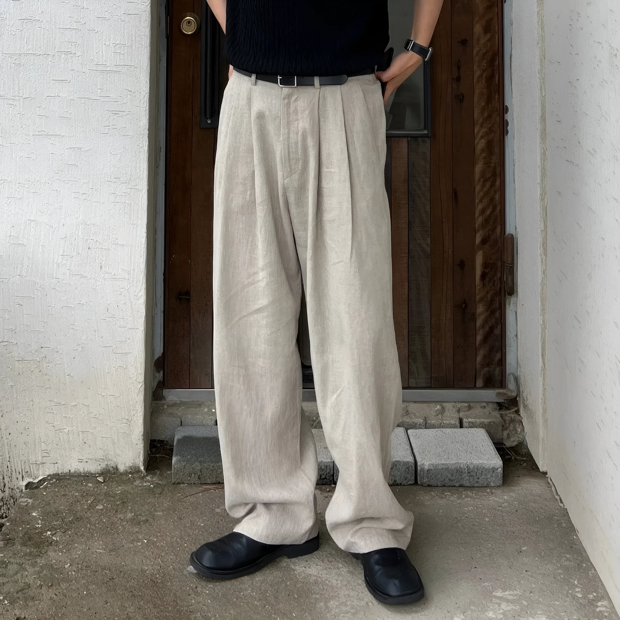 Army green men's casual drawstring waist trousers laid flat, showing the basic style and relaxed fit.