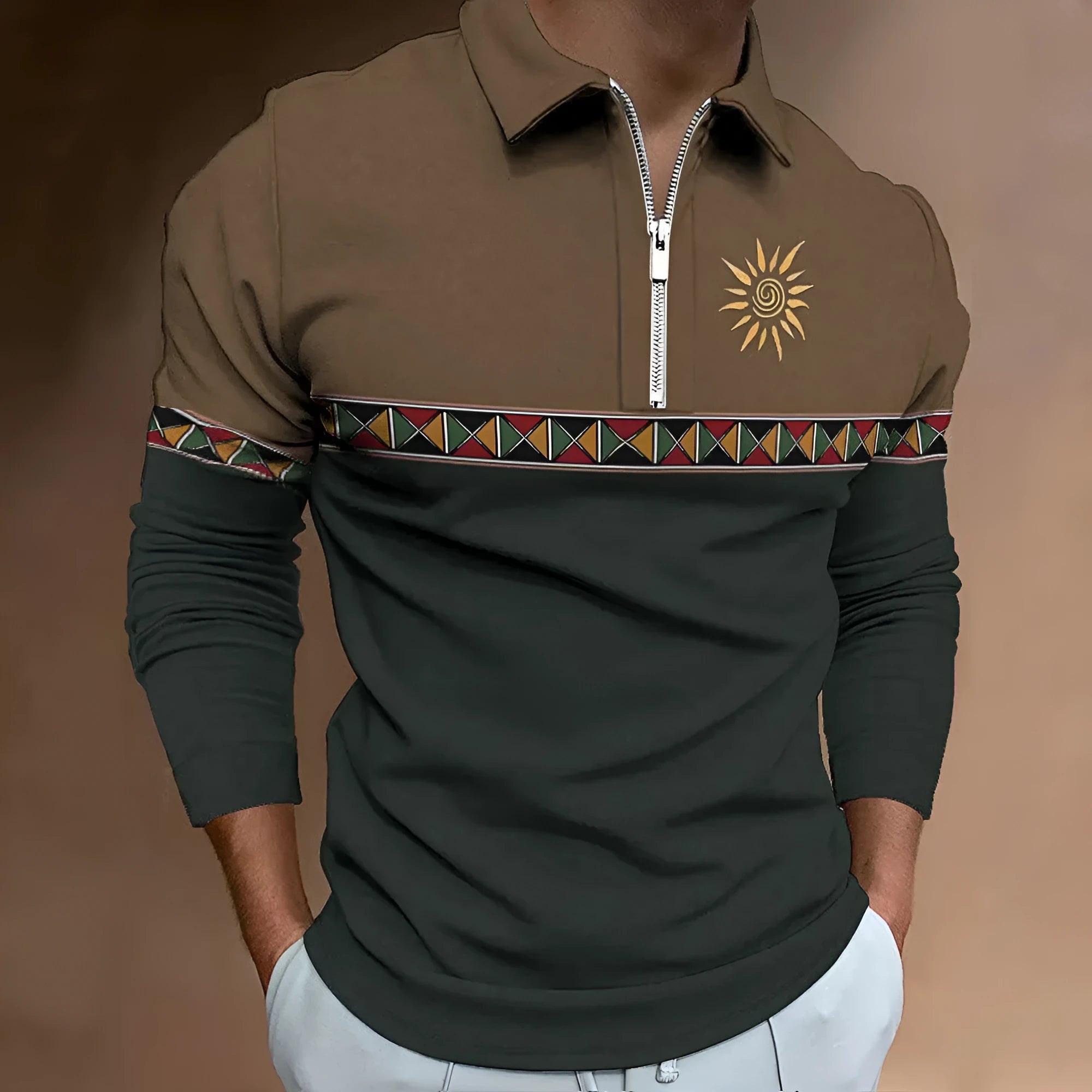 Man wearing a loose-fit, long-sleeve t-shirt with retro striped colour printing and a decorative zip detail.