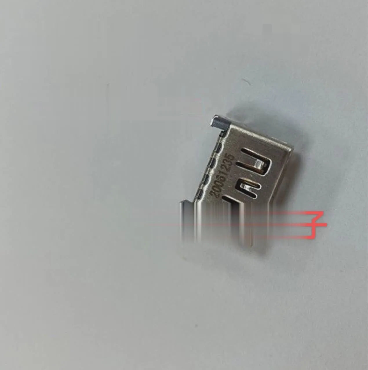 Silver HDMI host socket connector for game console repair.