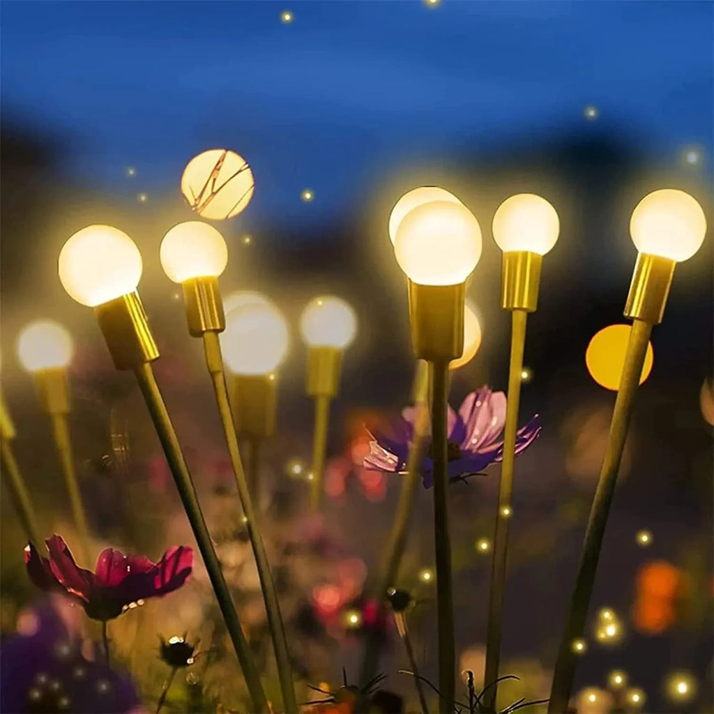 Solar-powered LED firefly garden light with multiple heads and a ground stake.