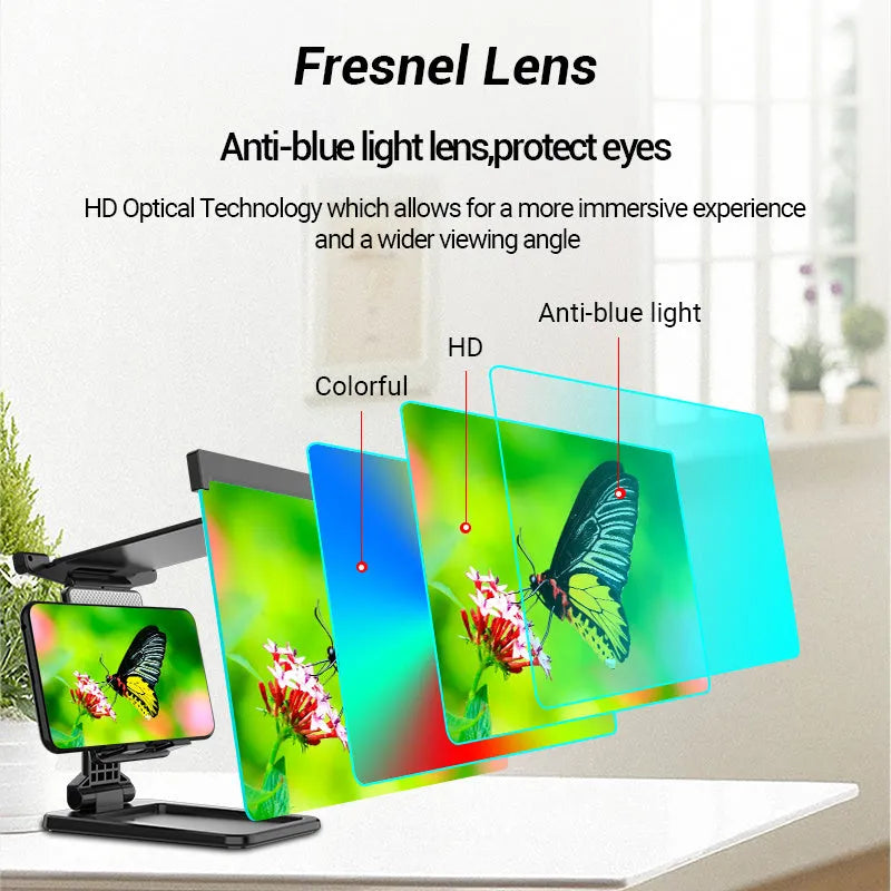 Black folding mobile phone screen amplifier with detachable holder on a desktop.