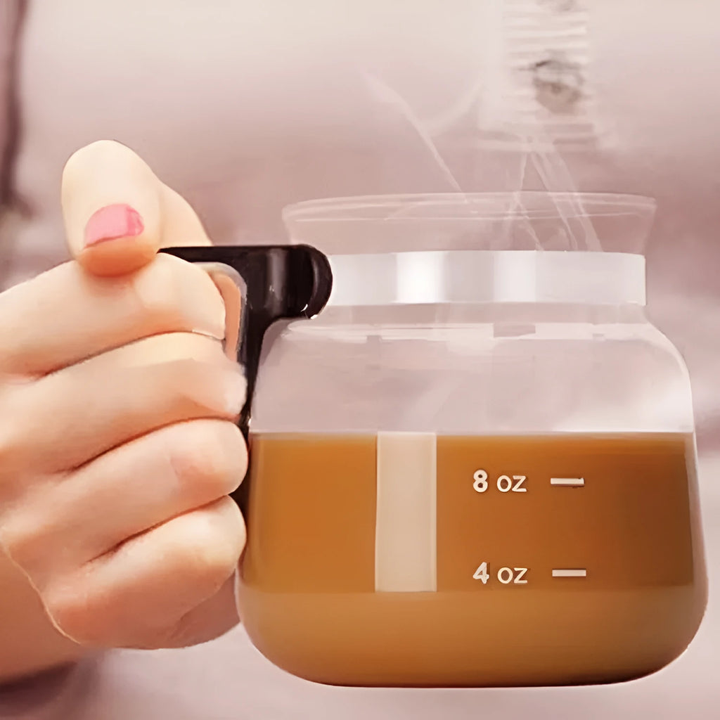 Transparent borosilicate glass stovetop coffee maker with grey silicone cover