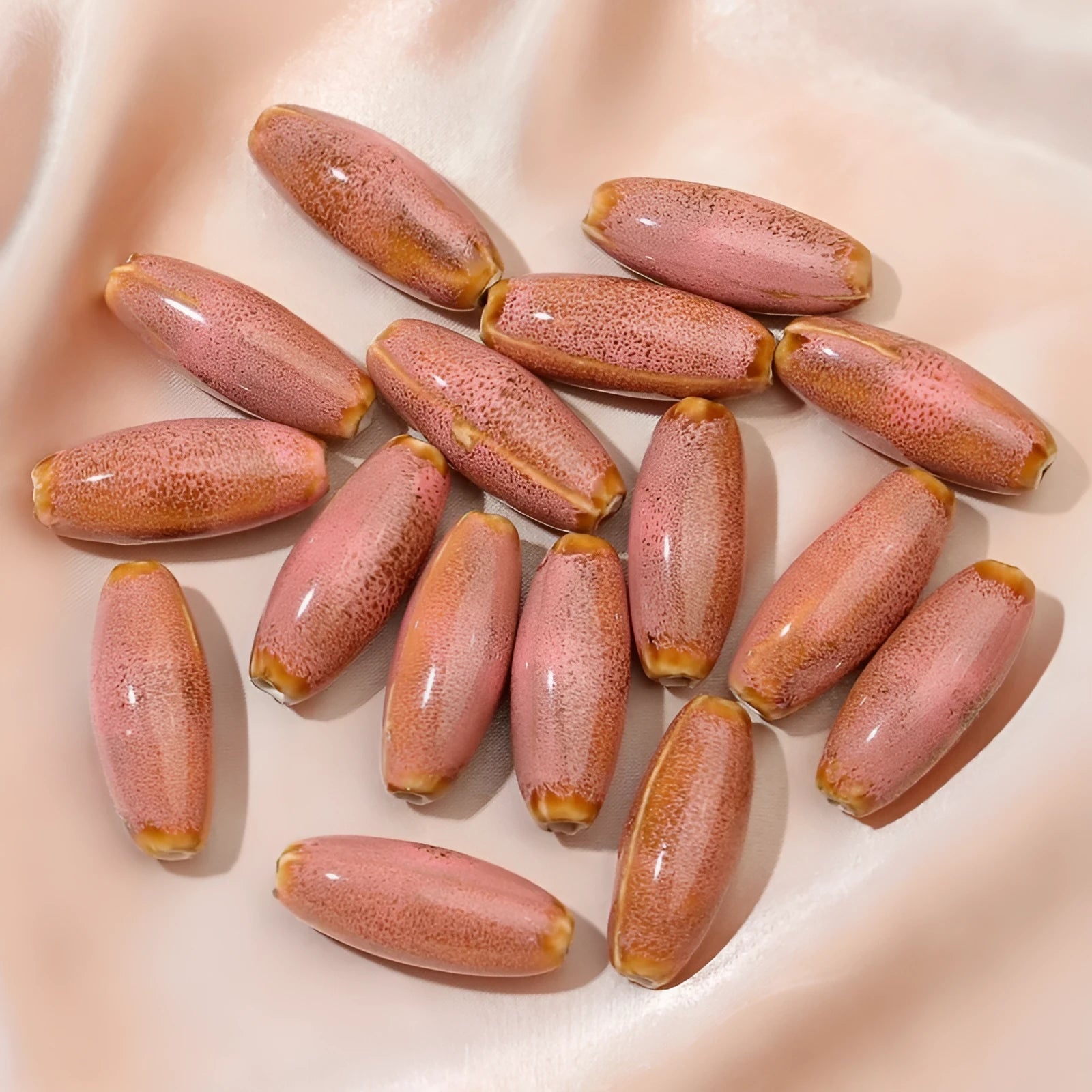 Ceramic bullet beads in seven colours for jewellery making and bracelet braiding