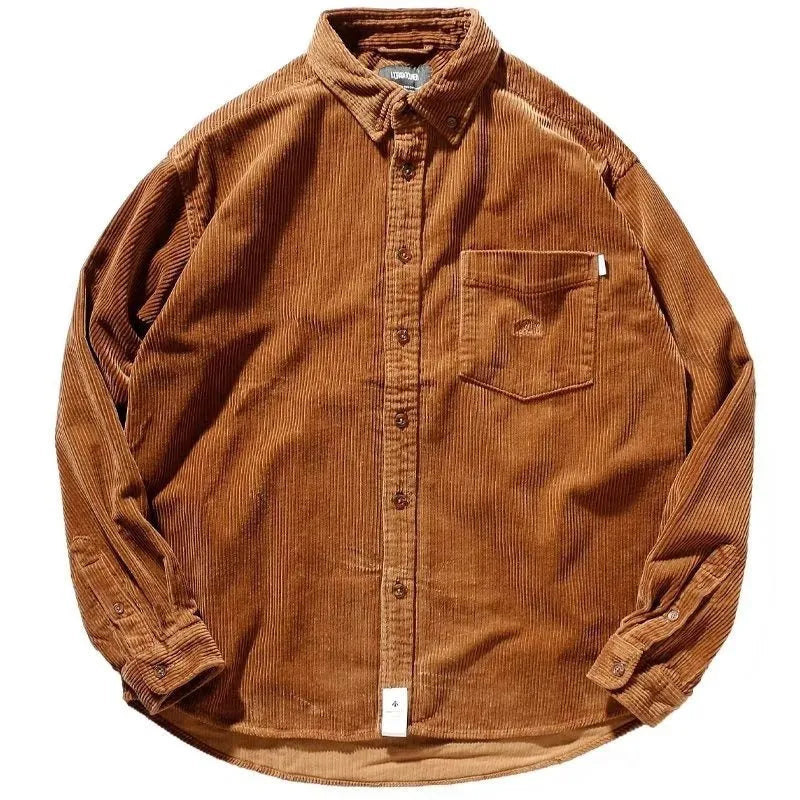 A caramel coloured corduroy loose shirt with long sleeves, shown in a cardigan style.