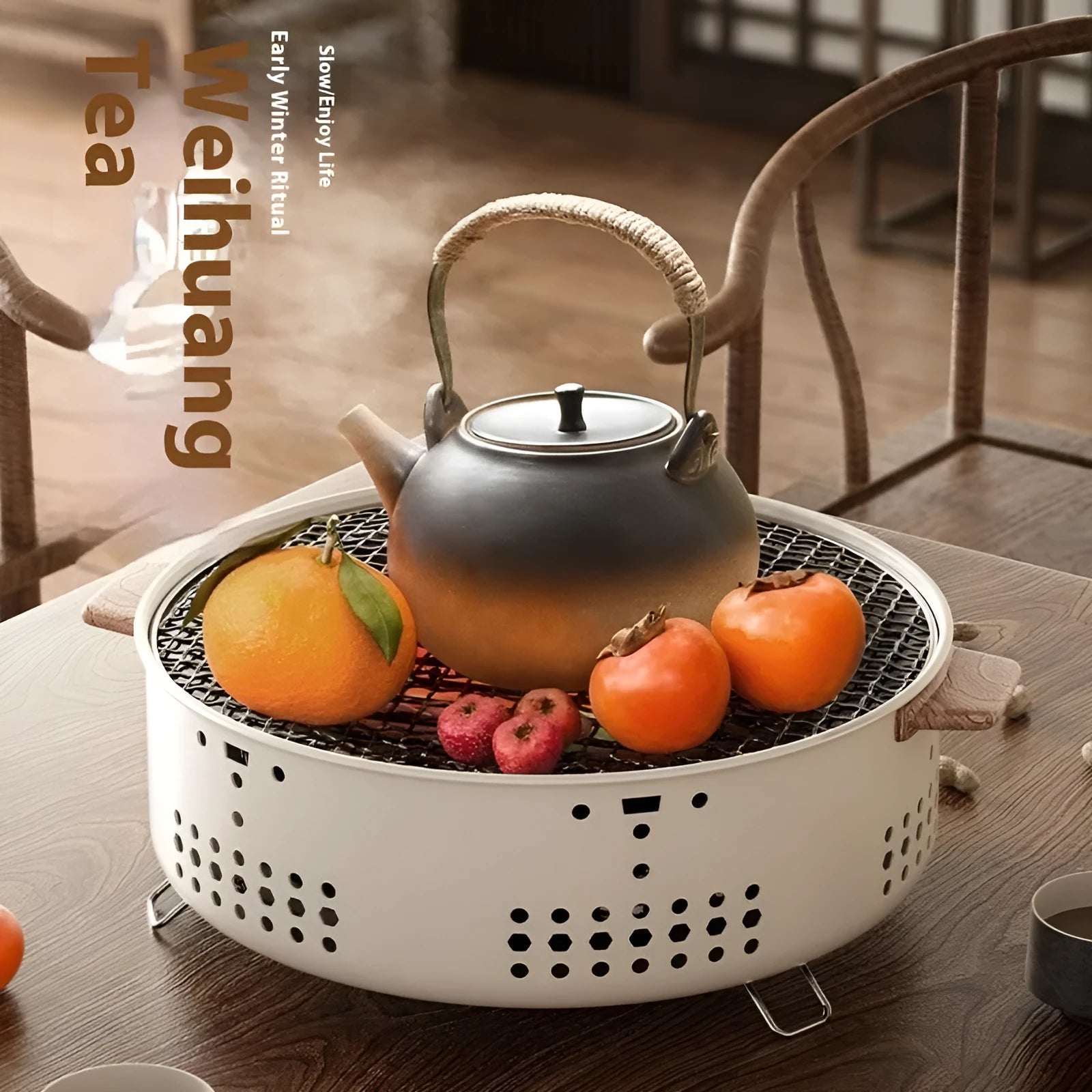 Portable indoor charcoal tea cooking stove with grill rack on a table.