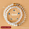 Handmade double ring crystal bracelet in five elements colours on a wrist.