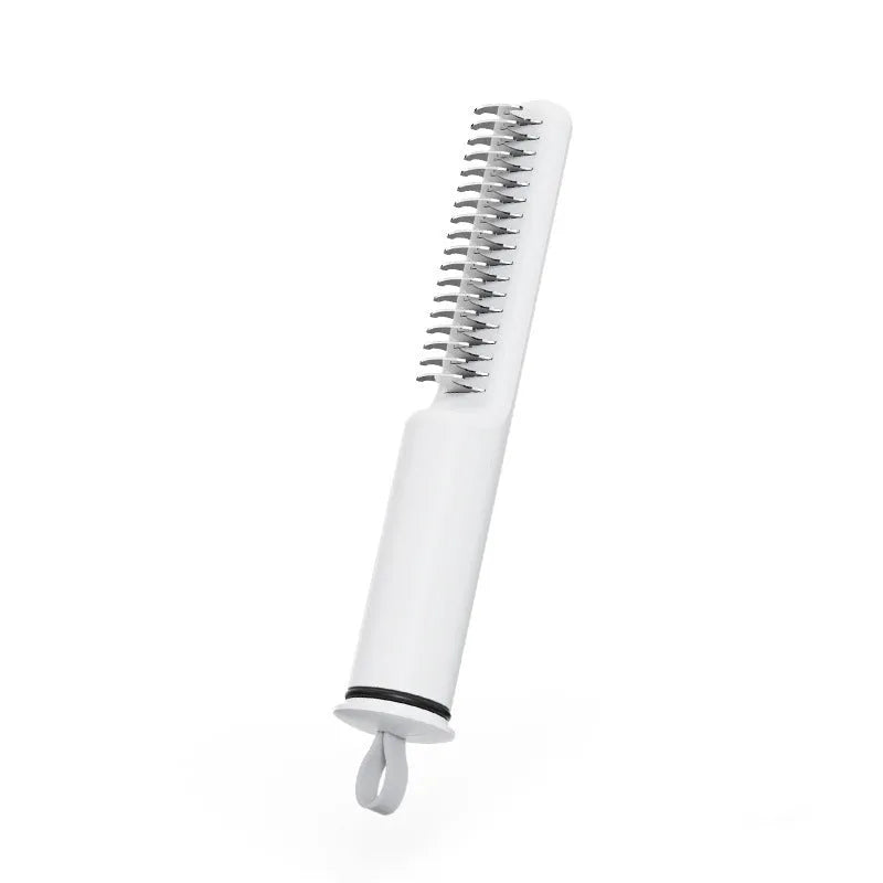 Stainless steel pet dematting comb with ergonomic handle for removing dog hair knots and mats.