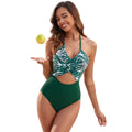 Women's black one-piece swimsuit with printed patchwork leaf pattern showing front design