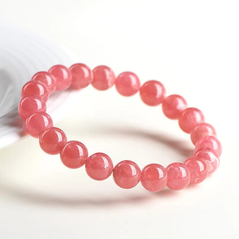 Women's geometric rhodochrosite crystal bracelet with longevity lock clasp in natural red patterned stone