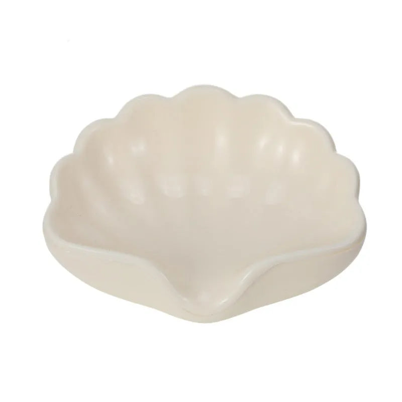 White and pink plastic shell-shaped soap dish for bathroom counter or shower