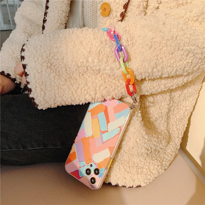 Personalised iPhone case with integrated wrist strap featuring graffiti design in TPU material