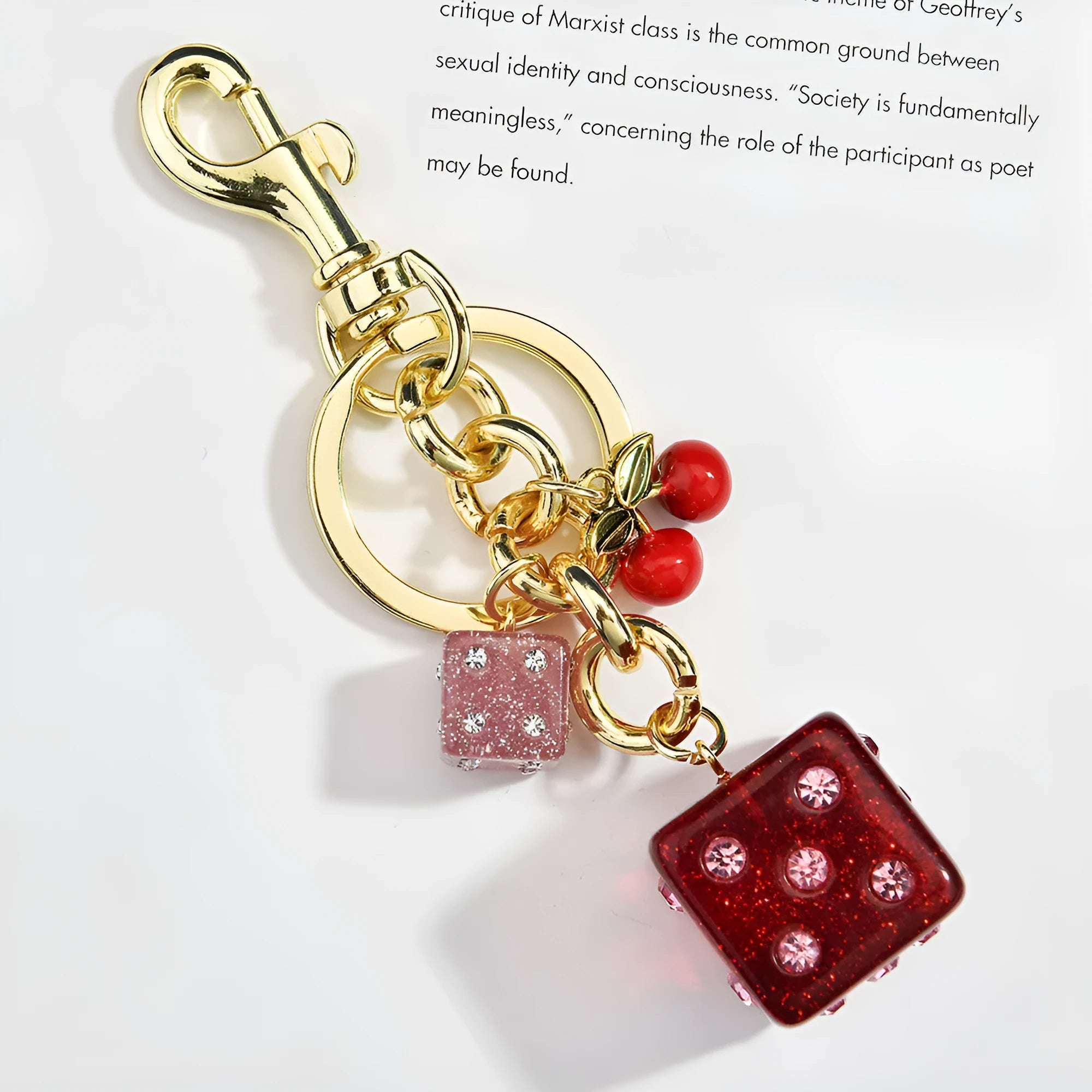 Square metal keychain pendant with a vintage cherry two-tone dice pattern and electroplated finish.