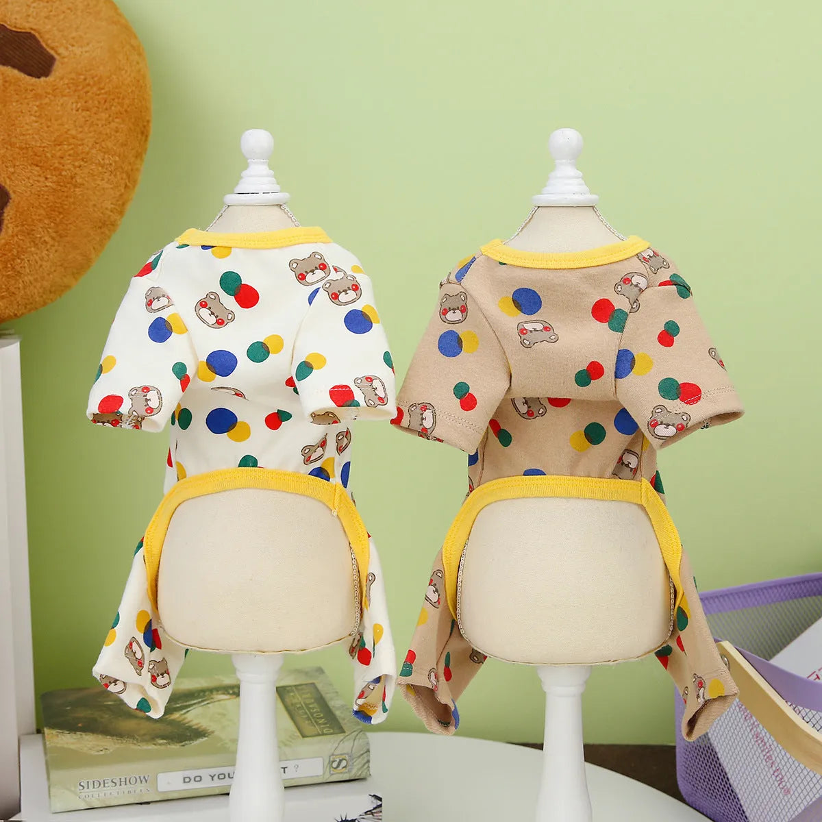 Beige dog jumper with colourful ball bear print, shown on a dog, made from cotton and spandex blend.