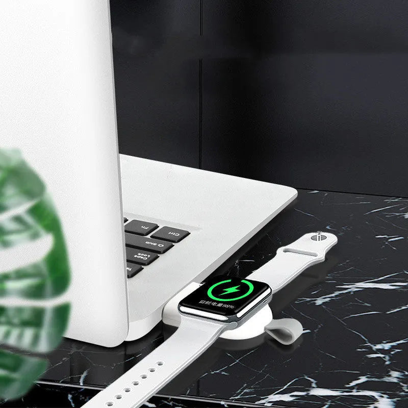 White portable wireless charging dock station for Apple Watch with USB cable.