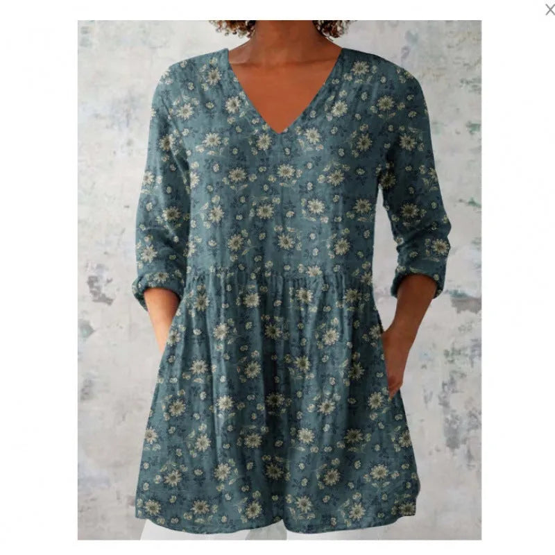 Women's loose floral print dress with wide waist and 3/4 length wave-pattern sleeves.