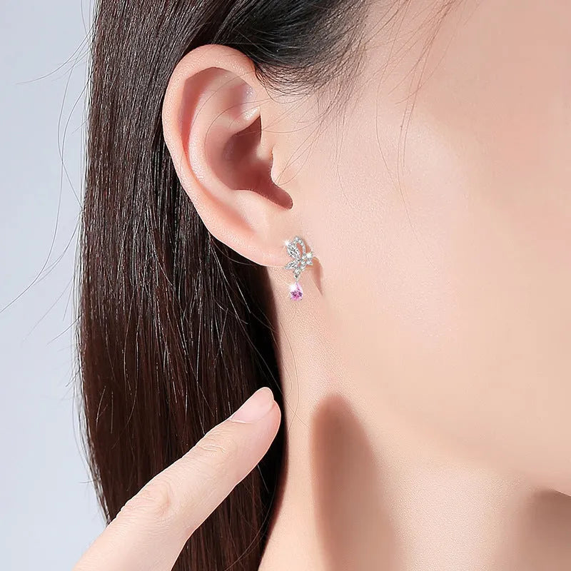 925 sterling silver butterfly stud earrings for women with purple crystal accents on a white background.