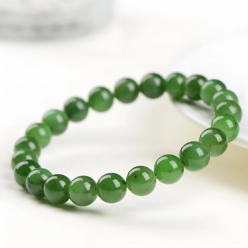 Natural Hetian jade ball bracelet with polished beads, shown in Jasper stone colour variations.