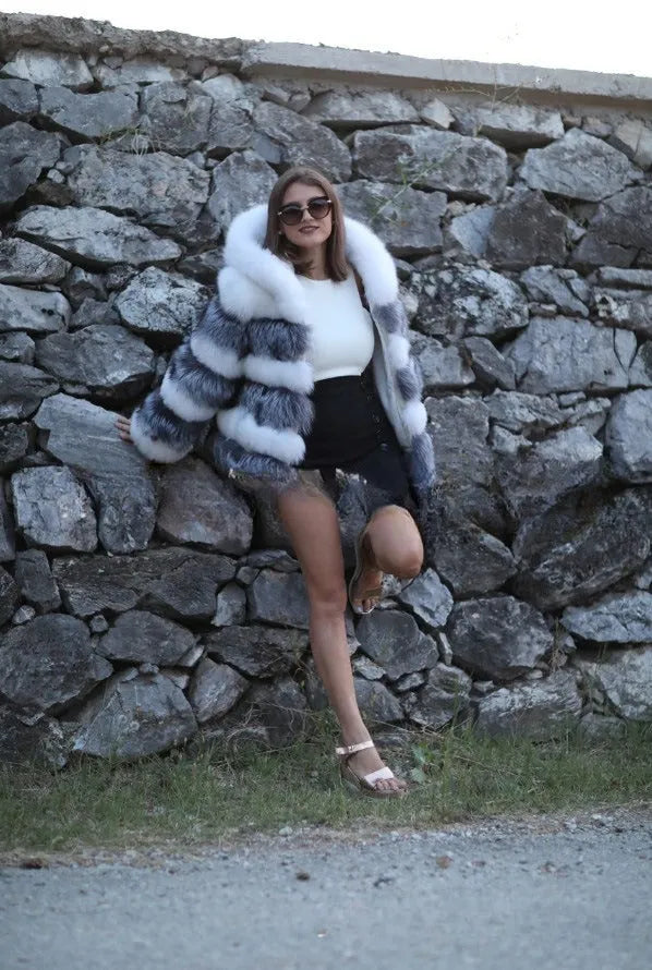 Women's loose-fit artificial fur hooded coat in street fashion style, shown in brown colour.