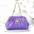 Women's soft polyester large-capacity dinner bag in shell shape with chain accents and diamond patterns.