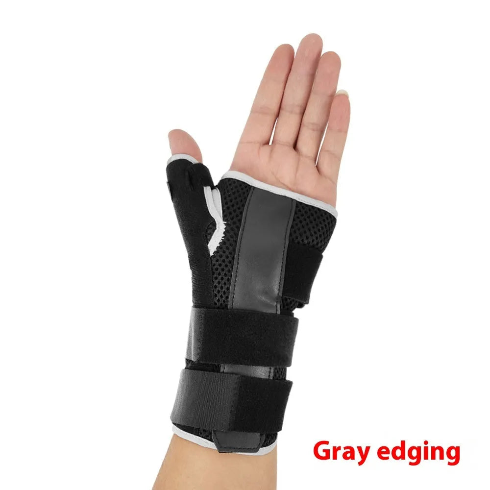 Carbon fibre sports wrist guard with thumb strap in black and grey, shown on a hand.
