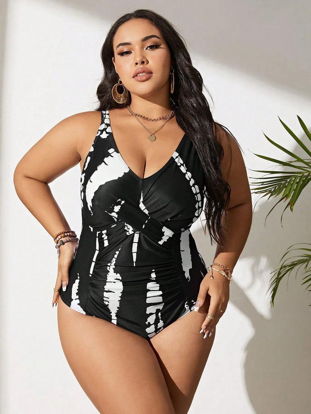 Black conservative one-piece swimsuit on a mannequin, showing sleeveless design and Siamese colour matching pattern.