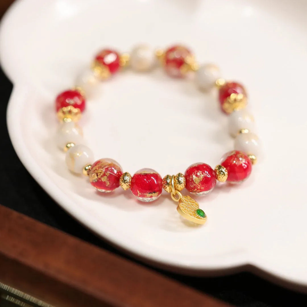 Women's ethnic bracelet with gold foil coloured glaze and geometric design