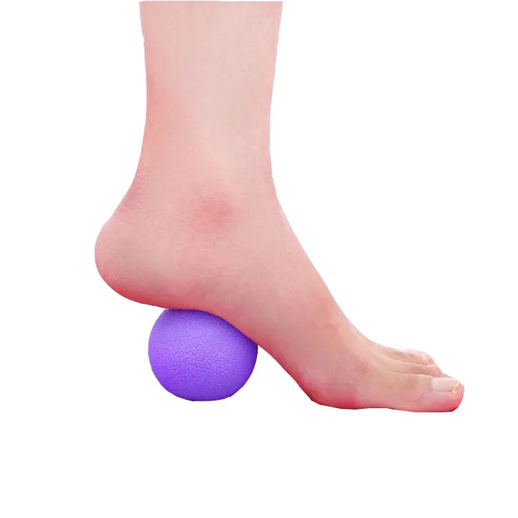 Green TPE yoga massage ball with 6.1 cm diameter on a plain background.
