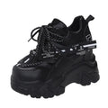 Women's white mesh platform sports shoes with a cross strap and rubber sole.