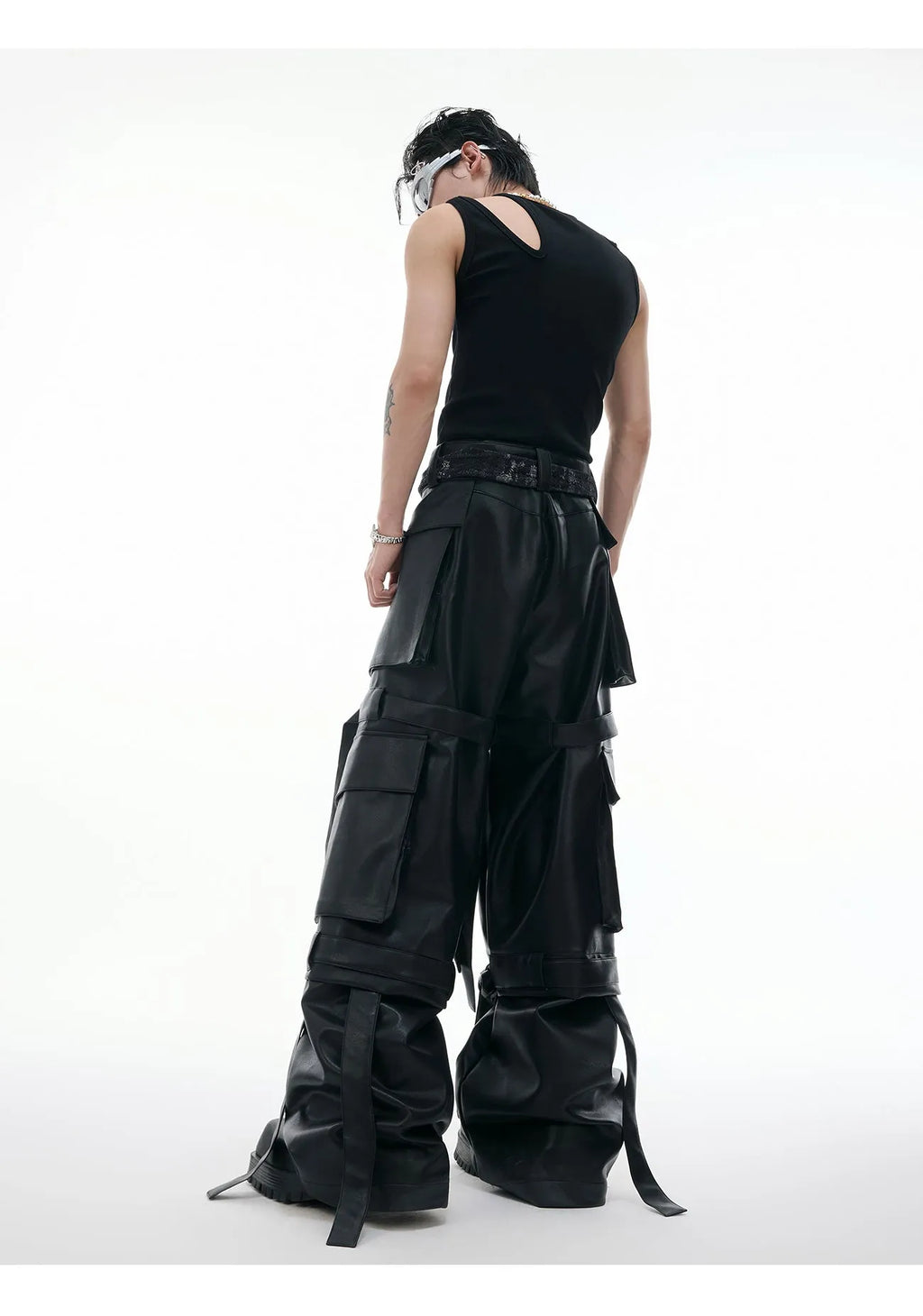 Black loose-fit quilted trousers with multiple pockets and PU leather composite fabric