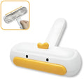 Yellow duck design portable pet hair remover brush with plastic body and polyester bristles.