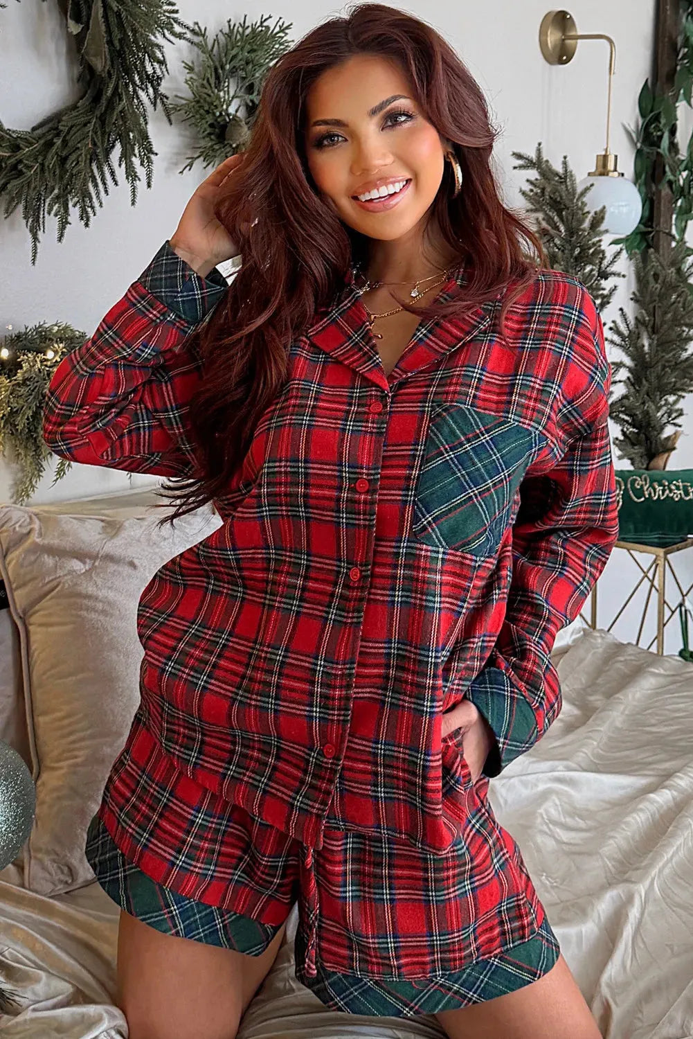 Red plaid two-piece pajama set with long sleeve shirt and shorts featuring contrast patches.