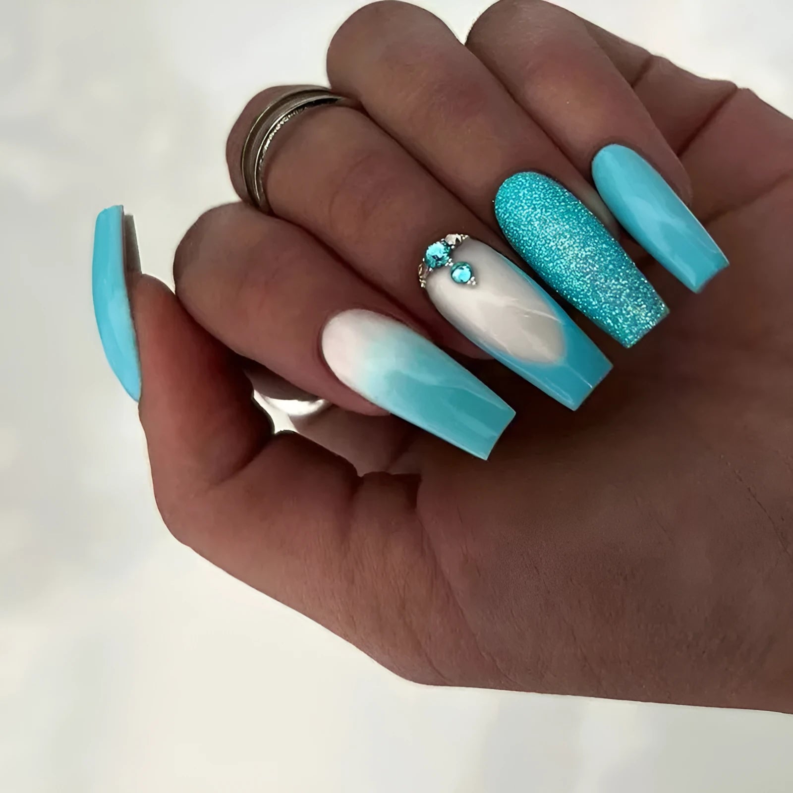 Smart blue diamond false nails with long ballet shape and included adhesive glue