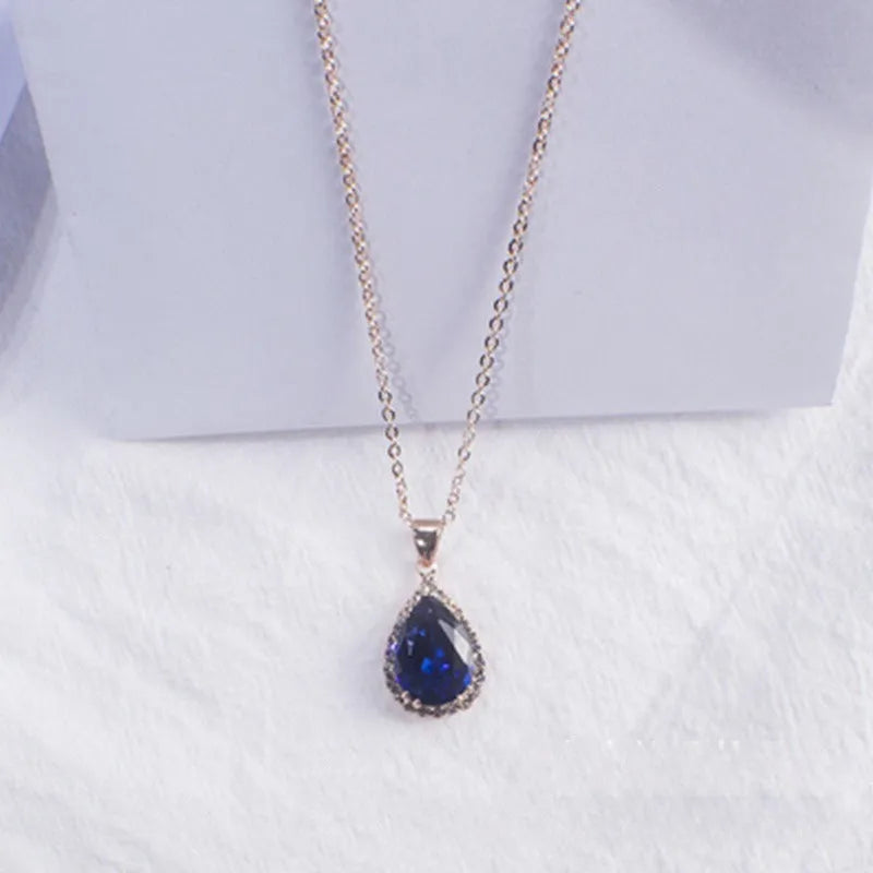 Rose gold water drop shaped women's necklace with geometric rhinestone decoration in pink colour