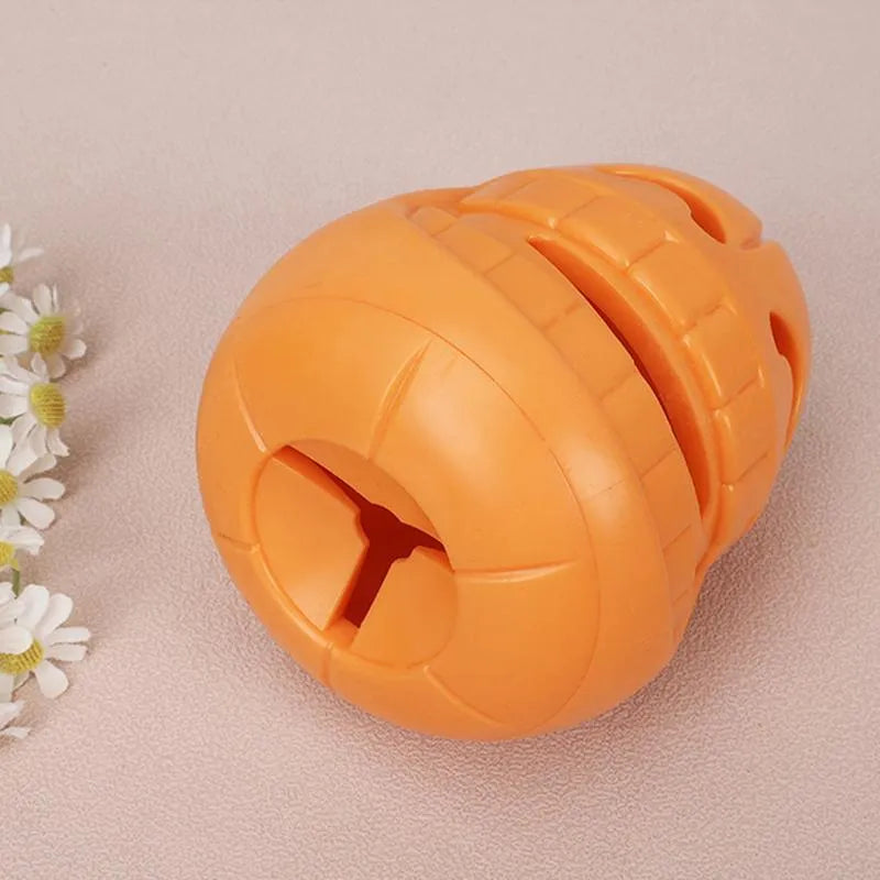 Yellow pumpkin shaped dog chew toy for aggressive chewers made from TPR material
