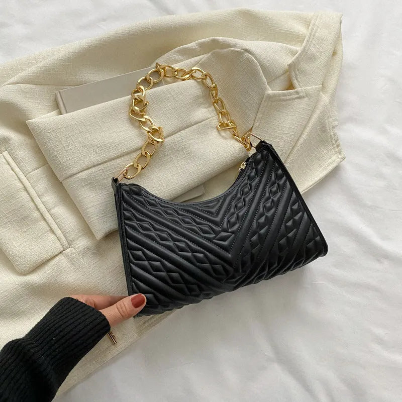 Brown pleated PU baguette shoulder bag showing its vertical square shape and chain strap.