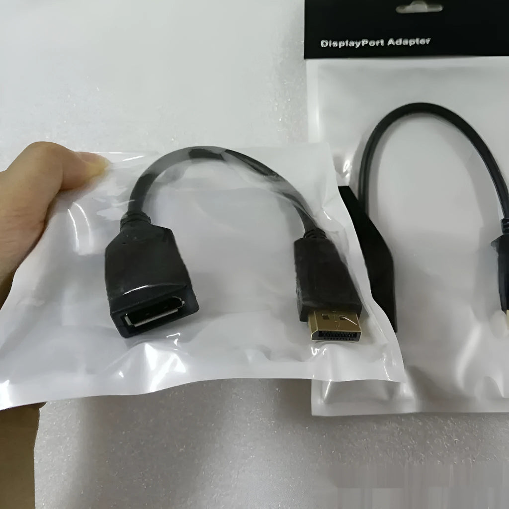 Black DisplayPort DP male to female extension cable with rotating connector, approximately 10cm long