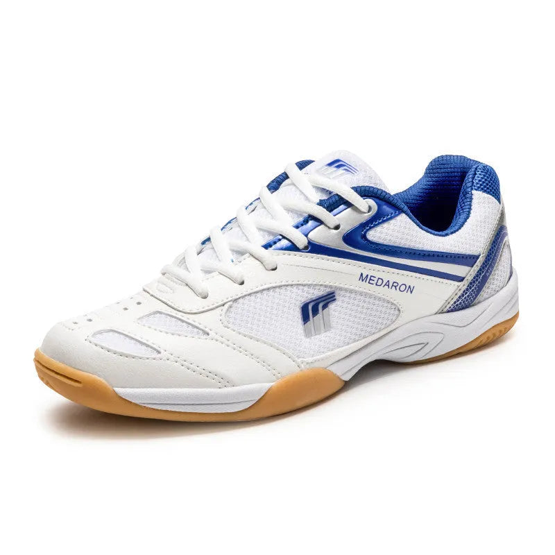White table tennis sneakers with mesh upper and rubber sole in red or blue accents