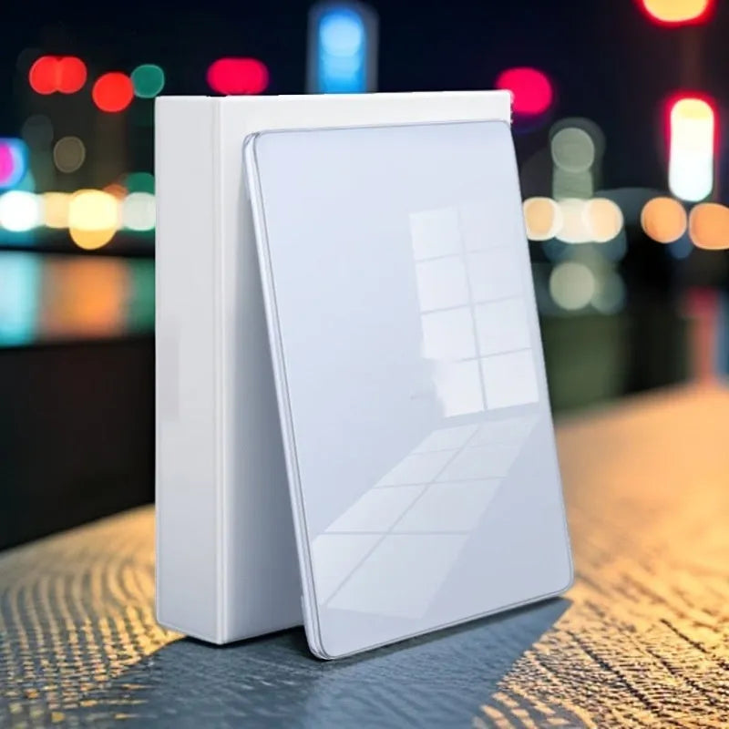 Transparent plastic protective case for a MacBook laptop on a table.